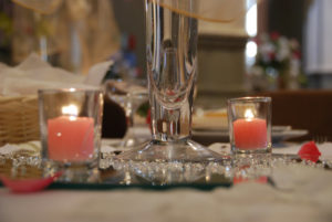 Pink candles in glass holders